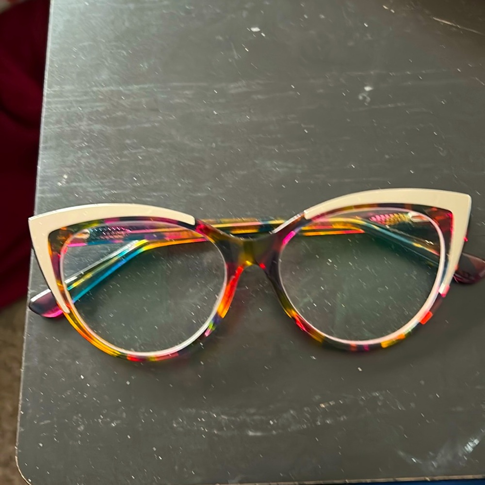 Purpleish green orange glasses with a silver gold color cat glasses
